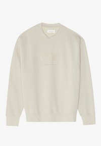 Cream-colored sweatshirt made of soft fabric. Features a round neck, long sleeves, and embroidered "ONE" branding on the front.