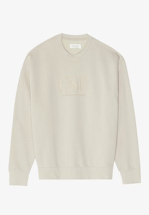 Sweatshirt crème en tissu doux. Présente un col rond, des manches longues et un logo brodé "ONE" à l'avant.