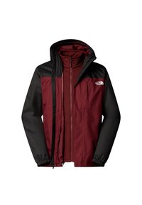 Veste à deux couches bordeaux et noire avec fermeture éclair, capuche attachée et logo blanc "The North Face" sur la poitrine.