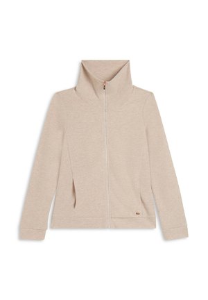 Veste beige à fermeture éclair avec col montant, manches longues et poches latérales, posée à plat sur un fond blanc.