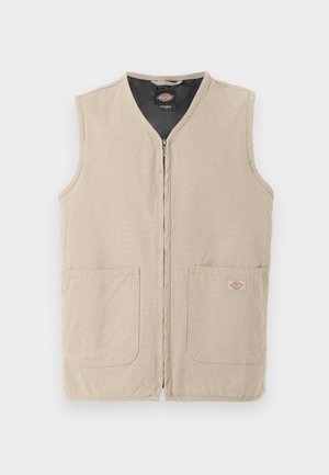 Veste de travail sans manches beige avec fermeture éclair frontale, deux grandes poches avant et doublure intérieure noire.