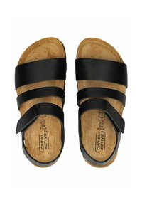 Sandales en cuir noir avec trois larges sangles et une fermeture Velcro, dotées d'une semelle intérieure en liège moulé et d'une surface texturée.