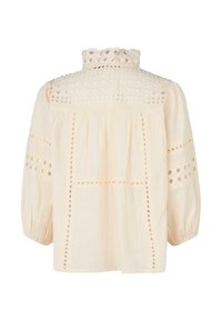 Helle beige Bluse mit Rüschengürtel, ausgestatt mit gestickten Ausschnitten und lockerem Schnitt, langen Ballonärmeln und einem gerafften Rückenpaneel.