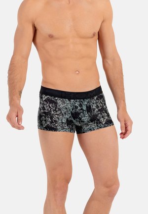 Herren Boxershorts im schwarz-grünen Blumendesign, mit einem schwarzen Bund und dem Markennamen "HOM". Hergestellt aus weichem Stoff.
