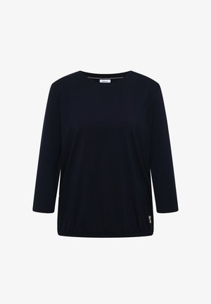 Zwarte lange mouwen top met ronde hals, elastische zoom en klein logodetail nabij de onderrand, weergegeven op een witte achtergrond.