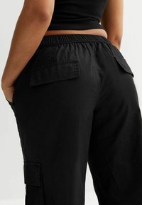 New Look Petite Reisitaskuhousut - black