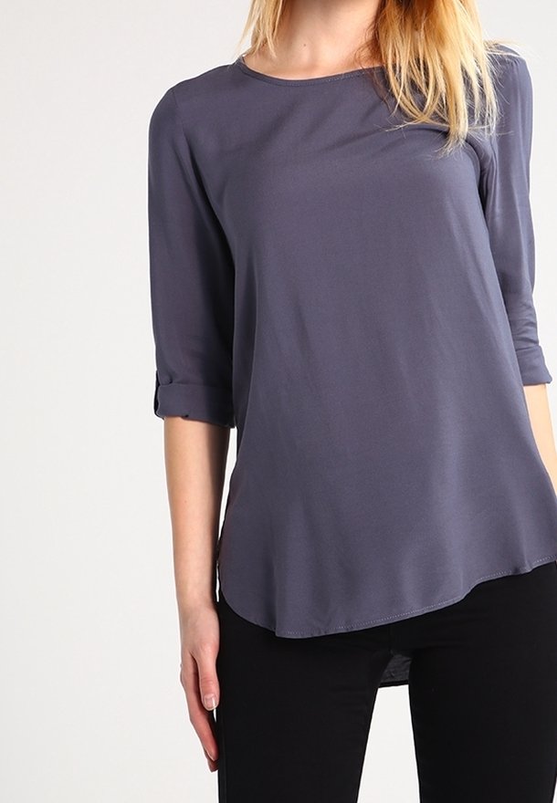 Gray, lightweight blouse with three-quarter sleeves, a round neckline, and rolled cuffs, featuring a slightly curved hem.