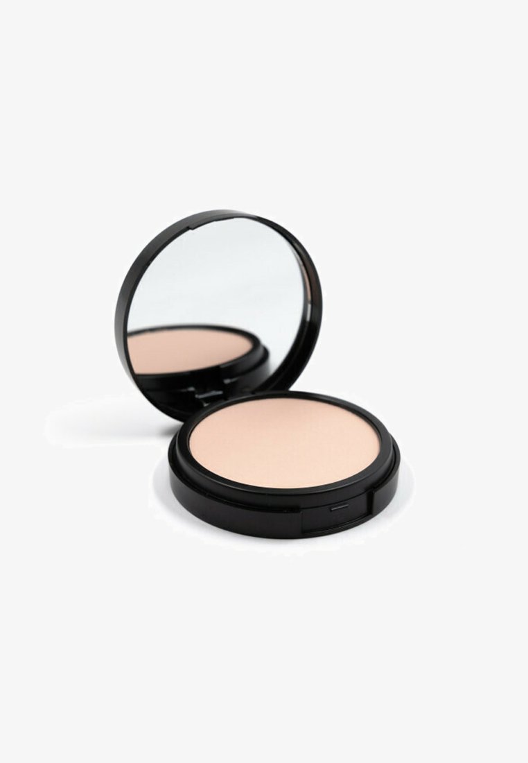 Caso di cipria compatto nero con specchio; di forma circolare, con superficie liscia; polvere color beige chiaro all'interno. Design minimalista con chiusura facile da aprire.