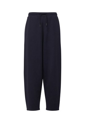 Schwarze Sweatpants mit Kordelzug, elastischem Bund und Seitentaschen, konisch zulaufendes Bein, vor weißem Hintergrund.