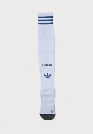 Fehér, térdig érő zokni kék, háromcsíkos szegéllyel, a "ITALIA" felirattal és tengerészkék Adidas logóval, texturált szürke talppal.