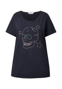 T-shirt en coton noir présentant un design de crâne brodé en vert et rose avec des étoiles. Coupe décontractée et décolleté arrondi.