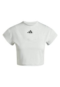 Lühikesed varrukad ja ümar kaelus, valgest sportlikust T-särgist kärbitud mudel. Rinnal on must Adidas'i logo. Sile kangastekstuuri.