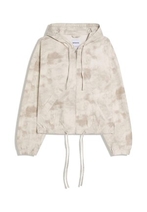 Lys beige lynlåstrøje med subtilt batikmønster, forlommer, snore i hætte og kant, elastiske manchetter og mærke indeni kraven.