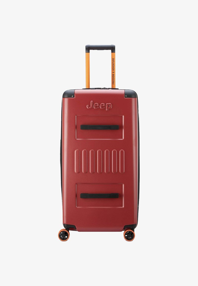 Valigia rigida rossa con superficie testurizzata, accenti neri, manico arancione e ruote piroettanti. Presenta il logo Jeep sul davanti.