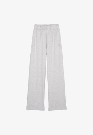 Šedé teplákové kalhoty z měkké látky, s širokým střihem nohavic, elastickým pasem a malým logem na přední straně.