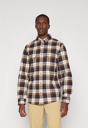 Geruite shirt in bruin, crème en marineblauw met lange mouwen, twee borstzakken en knoopsluiting. Gemaakt van textured stof.