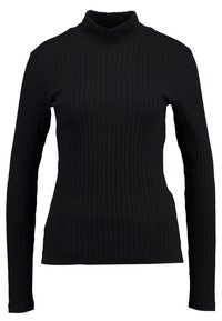 Svart långärmad polokrage-top i ribbat material. Har en figurnära silhuett och en hög krage med vertikala ribbdetaljer.