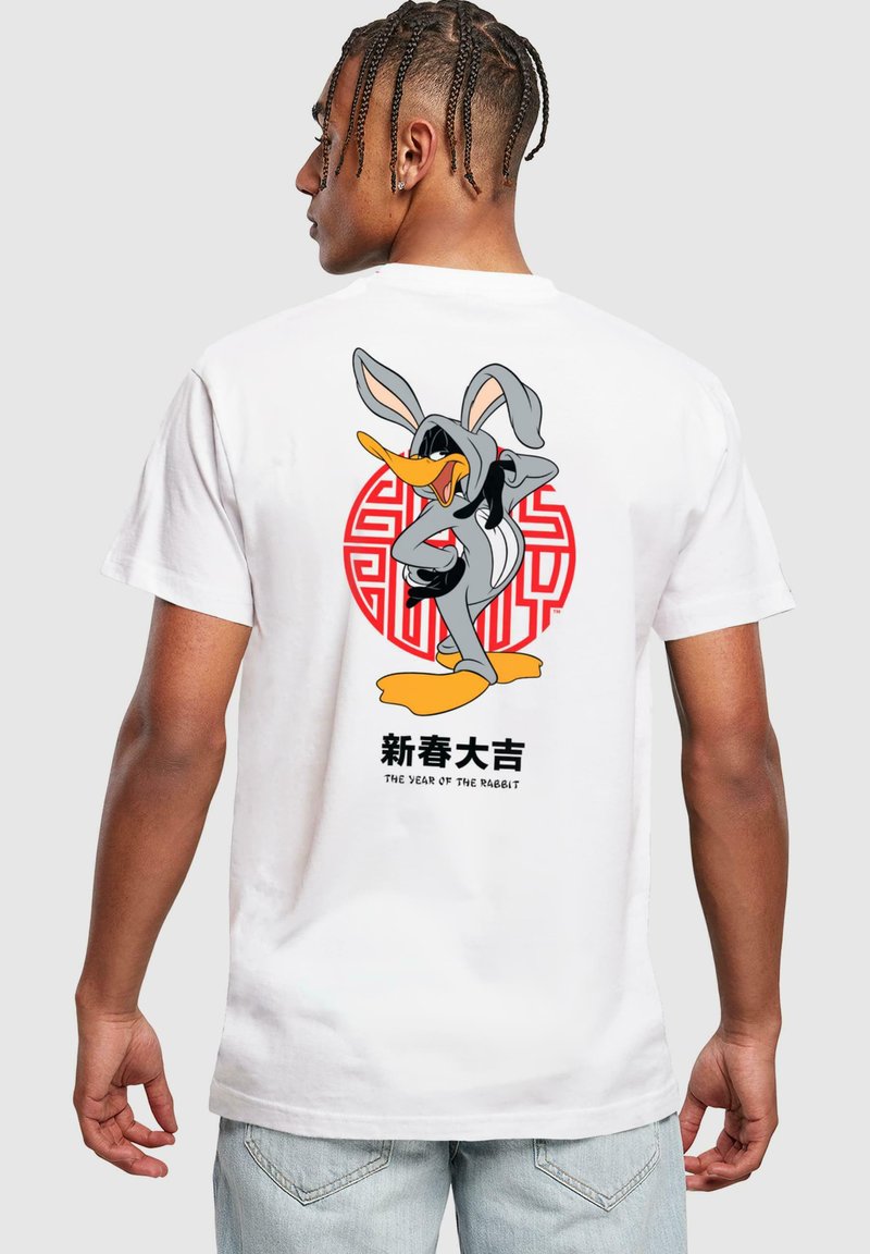 White cotton t-shirt featuring a graphic of a cartoon duck in a gray hoodie, with red circular design and Chinese text, "The Year of the Rabbit."