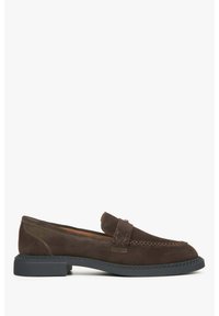Brown suede loafer with a leather strap detail, round toe, and black rubber sole. Subtle stitching accents enhance the overall design.