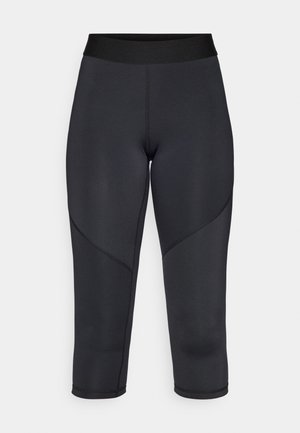Black three-quarter length leggings made of stretchy fabric, featuring a smooth texture, high waistband, and curved seam detailing.