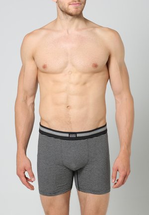 Schwarz und grau gestreifte Boxershorts mit einem elastischen Bund, der den Markennamen trägt. Weicher Stoff mit einer engen Passform und einer Länge bis zur Mitte des Oberschenkels.