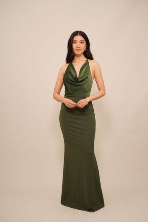 Satin green halter dress with a cowl neckline, form-fitting silhouette, and a smooth finish, featuring a floor-length hemline.