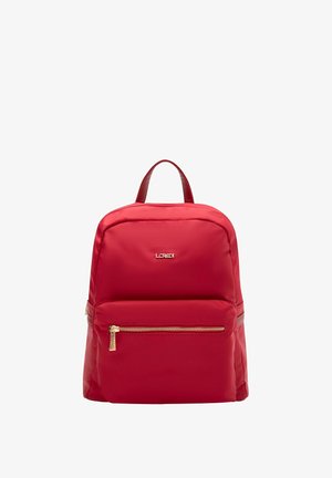 Red nylon backpack with a smooth texture, a main zippered compartment, a front zippered pocket, and a top handle. Gold-tone hardware accents.