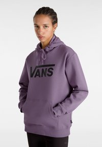 Felpa con cappuccio viola, caratterizzata da un grande logo nero "VANS", con coulisse regolabile e tasca frontale a marsupio. Realizzata in materiale morbido con polsini a costine.