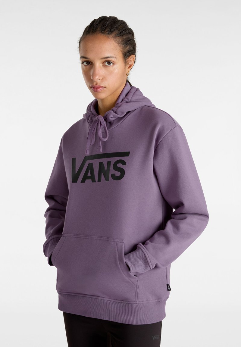 Felpa con cappuccio viola, caratterizzata da un grande logo nero "VANS", con coulisse regolabile e tasca frontale a marsupio. Realizzata in materiale morbido con polsini a costine.