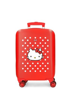Maleta roja con lunares blancos que presenta una cara de Hello Kitty y cuatro ruedas rojas con borde negro.