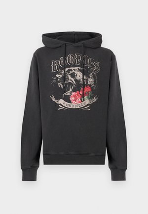 Zwarte hoodie met voorop een grafische afbeelding van een brullende panter, rode bloemen en de tekst "KOOPLES" en "WILD TOUR" op een crèmekleurig lint eronder.