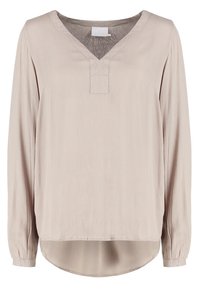 Blouse longue beige clair à manches longues avec un décolleté en V et une patte de boutonnage. Fabriquée en tissu texturé, elle présente un ourlet arrondi et des poignets élastiqués.