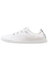 White canvas sneakers with a textured surface, round toe, lace-up front, and a rubber sole. Features logo accents on the heel.