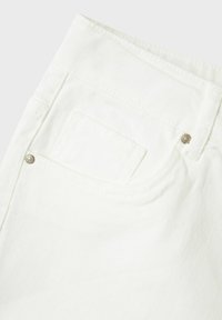 White corduroy fabric section showing a back pocket with a silver rivet and stitching details. The texture is ribbed and smooth.