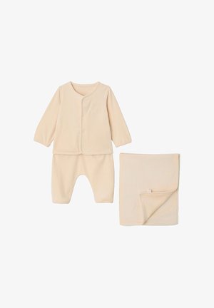 Cream-colored ribbed baby outfit with long-sleeve top, pants, and matching folded blanket on white background.