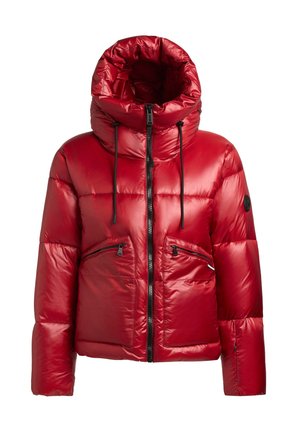 Punane punnis jope suures kapuutsis, esikinnitus tõmblukuga ja kaks tõmblukuga taskut. Valmistatud läikivast, ruutpadjast materjalist, millel on paeladetailid.