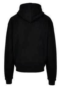 Felpa con cappuccio nera, dal taglio morbido, realizzata in un tessuto testurizzato, con polsini a coste e un design semplice senza loghi o motivi visibili.