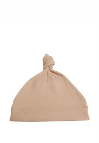 Cappello in cotone beige a maglia con una texture a coste, dotato di un nodo superiore arricciato e un bordo ripiegato alla base.