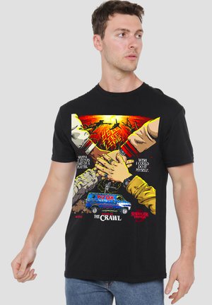 Hands stacked together above a WOK 94.5 FM van with "Stranger Things Chapter One The Crawl" text and fiery background.