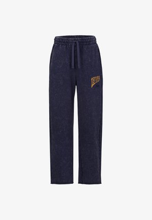 Marineblaue Freizeithose mit elastischem Bund, Kordelzug und gelbem "19769" Schriftzug am oberen linken Bein.