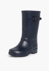 Botas de lluvia de goma en color azul marino con punta redonda, suela texturizada, hebilla lateral ajustable y acabado suave. El eje vertical proporciona soporte al tobillo.