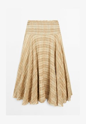 Beige geplooide rok met een uitlopende ontwerp, voorzien van een brede, elastische tailleband en een lichte, gestructureerde stof. Eindigt net onder de knie.