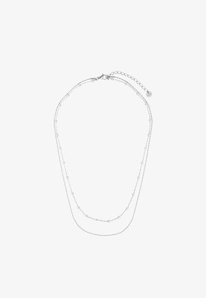 Sølvhalskjede med to lagdelte kjeder. Har små perler og en hummerlås med en forlengelseskjede for justerbar lengde.