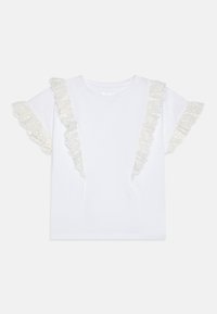 Camiseta blanca de manga corta con volantes decorativos de encaje en los hombros. Material de algodón suave, corte relajado y escote redondo.