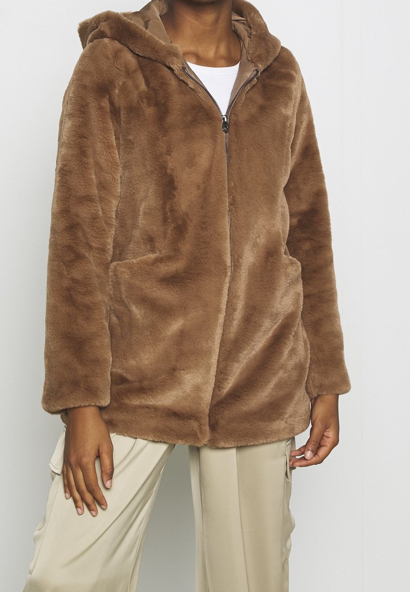 Brown faux fur jacket with a hood, zip closure, long sleeves, and side pockets. Soft texture and relaxed fit for comfort.
