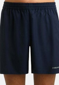 Pantaloni sportivi blu navy realizzati in tessuto leggero con vita elasticizzata e logo stampato sulla parte inferiore della gamba sinistra.