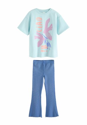 Light blue short-sleeve t-shirt with pink birds and "HI CIAO" text paired with blue flared pants with ruffled hems.