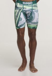 Grønne og hvite boxerbriefs med et pengedesign, med bilder av 100-dollarsedler og et mykt, elastisk stoff for komfort.