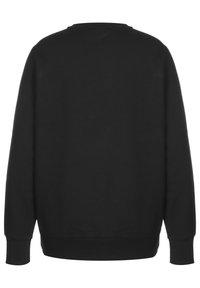 Black sweatshirt featuring a crew neck, long sleeves, and ribbed cuffs. Smooth texture with a plain design and no visible accents or patterns.