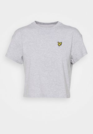 Grå kort t-shirt i mjukt tyg med en svart och gul broderad fjärilslogotyp på vänster bröst. Enkel design och klassisk passform.